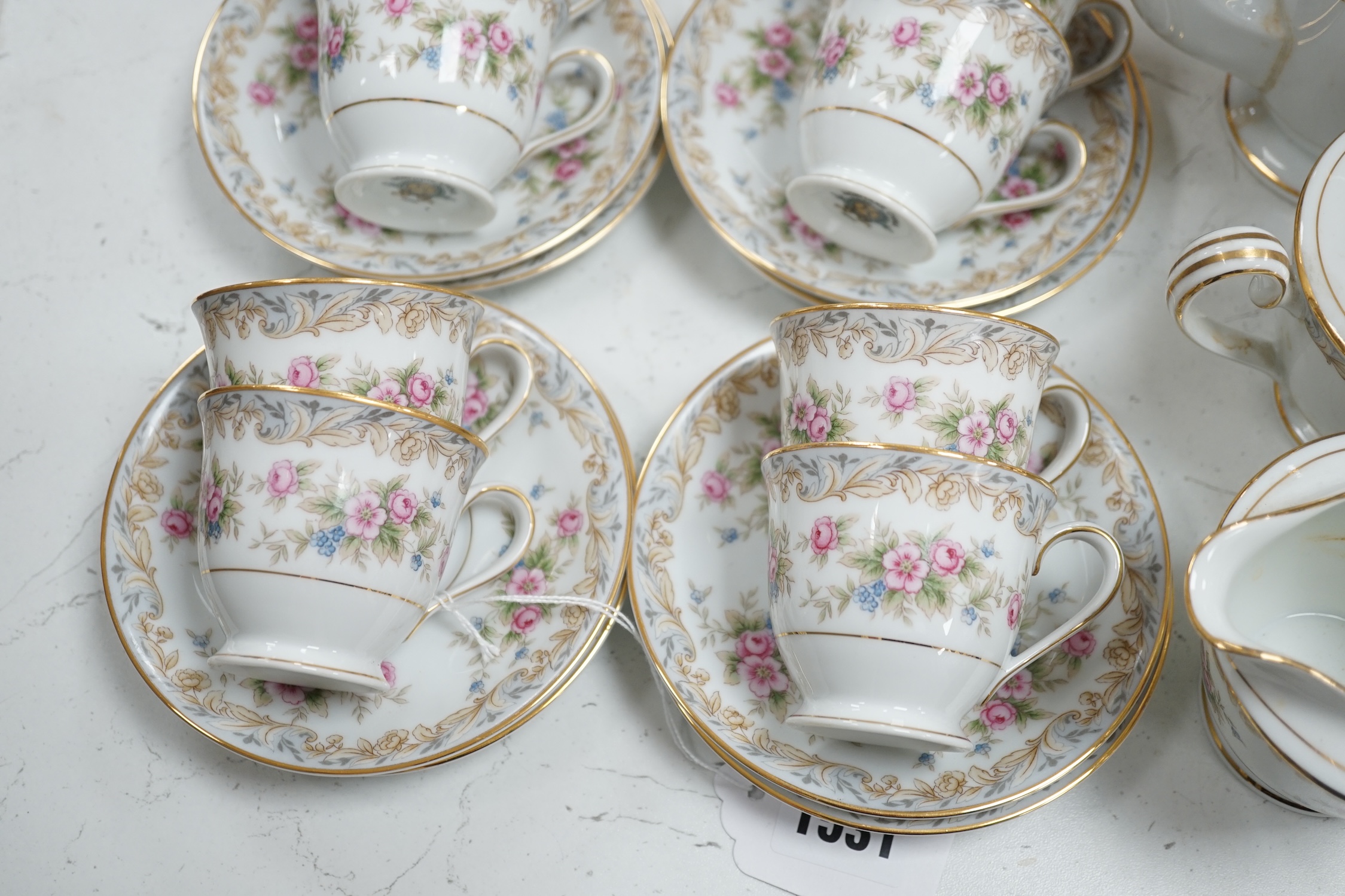 A Noritake eight cup and saucer floral coffee set